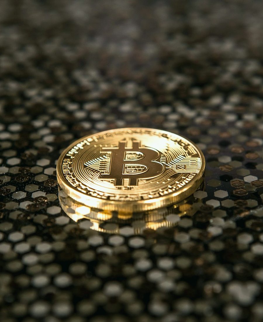 Gold coin on dark stone, flash USDT generator